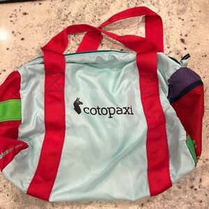 Cotopaxi Duffle Bag-multi color.  Side zipper pocket.